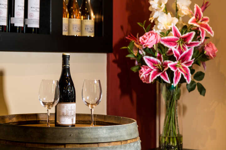 wine glasses and a vase of flowers at orestone manor